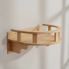 My Kitty City wall-mounted wooden cat shelf with a curved railing for resting and climbing in a natural wood finish.